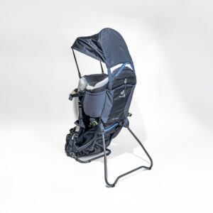 Navy blue Deuter child carrier with sun protection on a metal frame against a white background.